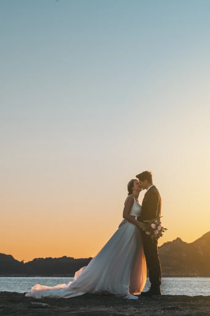 Just married couple against the sky